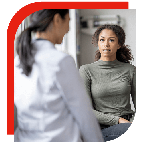 young woman talking with doctor