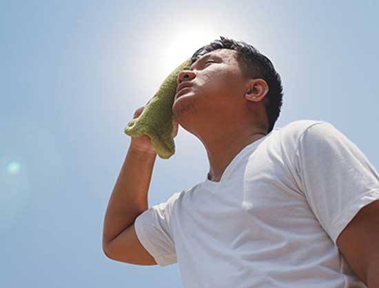 Man sweating in hot sun